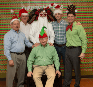 Tom Sr., Gene, Brian, Holton, William, and Bill Witchger pose for a picture at the 2015 Company Christmas party.