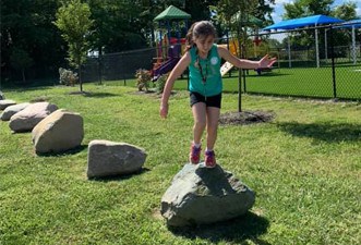 JumpingRocks Employees enjoying a rock jumping activity during a Marian Inc. event