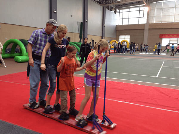 Employees and their families participating in an activity Employees and their families participating in an activity